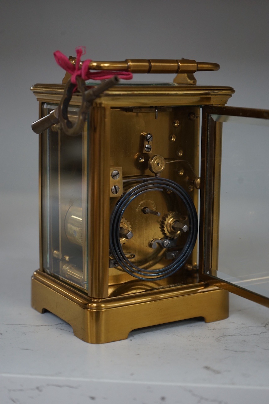 An early 20th century lacquered brass repeating carriage clock, 15cm, with key. Condition - externally good, not tested